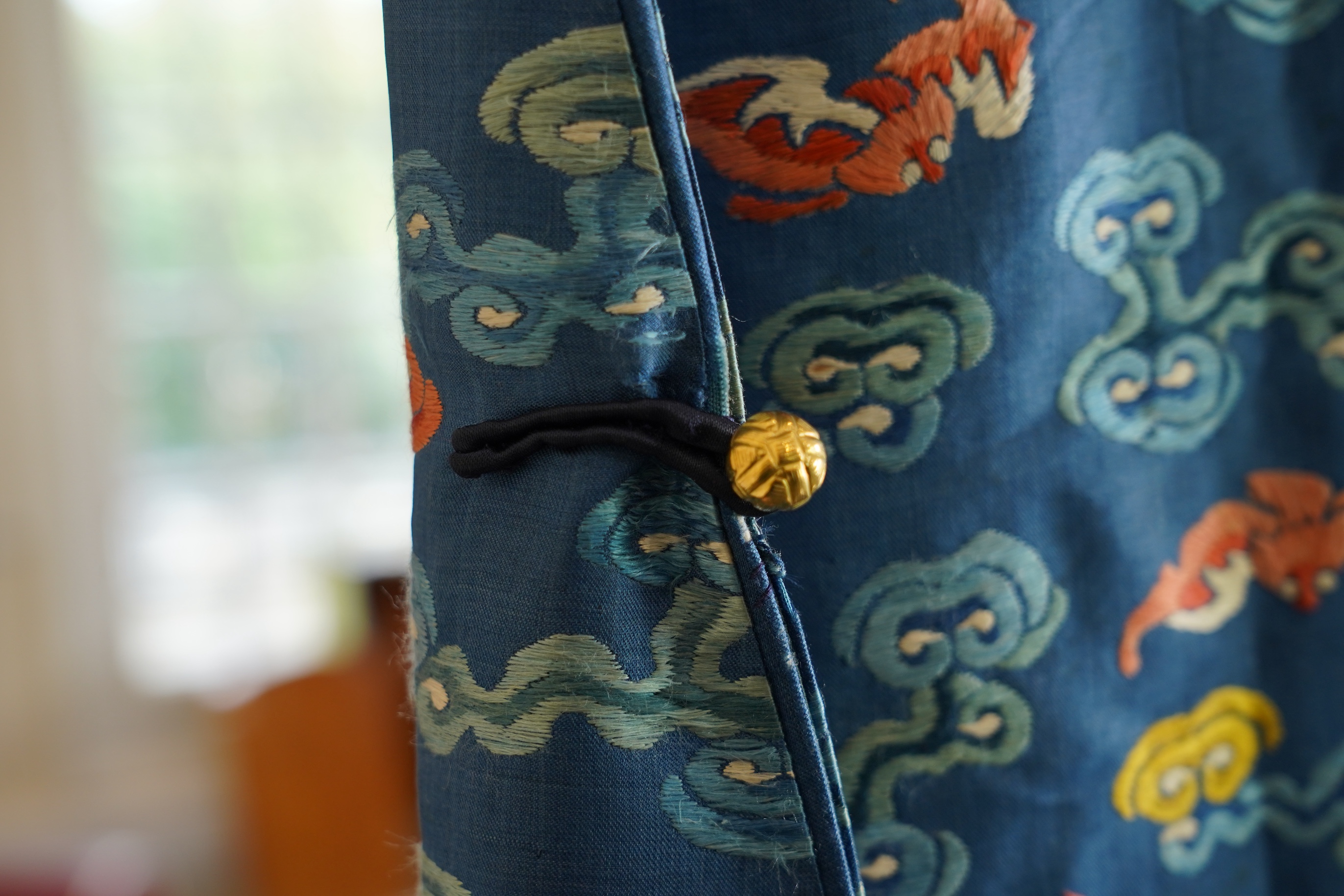 A Chinese blue silk man’s dragon robe, jifu, 19th century